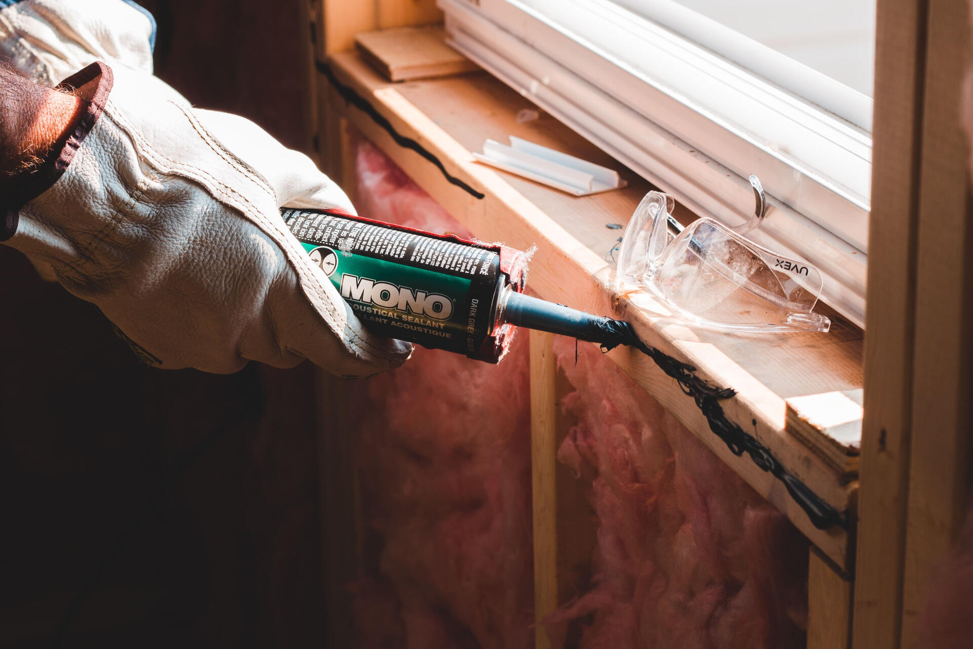 Man sealing wall by Eric McClean on Unsplash